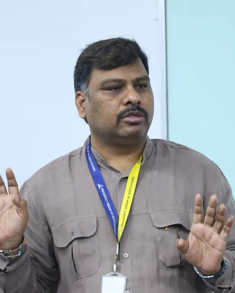 A Presidency PU teacher explaining a point at a staff workshop.